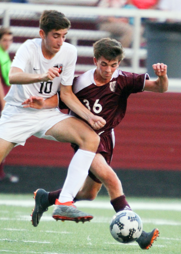 William D. Lewis The Vindicator Howland's Pano Gentis(10) and Boardman's Jake Hughes(36) during 9-13-18 action at Boardman.