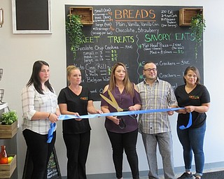 Neighbors | Jessica Harker.Morgan Erownoie, Aprile Johnson, Ammie Perez,  Jose Perez and Venice Rose prepared to cut the ribbon, officially opening the new Carbless Craze Cafe on Market Street in Boardman.