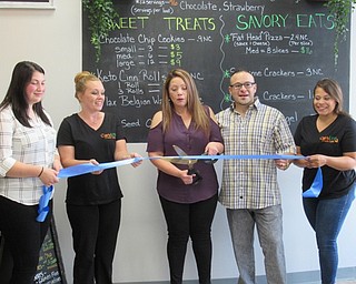 Neighbors | Jessica Harker.Ammie Perez, the owner of Carbless Craze Cafe, cut the ribbon Sept. 7 officially opening the store to the public.