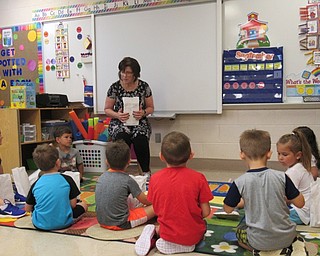 Neighors | Jessica Harker .Preschool teacher Terry Wittenaer instructed students on how to behave in class Sept. 7 at Poland Union Elementary's preschool program.