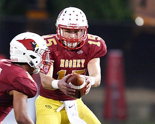 Cardinal Mooney's passes the ball to Chris Gruber during their game against St. Vincent-St.Mary at Stambaugh Stadium on Friday night. EMILY MATTHEWS | THE VINDICATOR