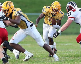 YOUNGSTOWN, OHIO -September 14, 2018: NILES RED DRAGONS vs YOUNGSTOWN EAST GOLDEN BEARS at Rayen Stadium- East Golden Bears' Eddie Bryant (2) runs for a 1st down during the 1st qtr.  MICHAEL G. TAYLOR | THE VINDICATOR