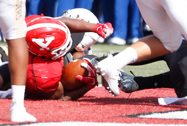 Youngstown's Tevin McCaster falls back to score a touchdown during the first half of their game against Valparaiso on Saturday at Stambaugh Stadium. EMILY MATTHEWS | THE VINDICATOR