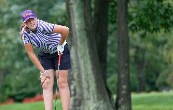 Avery Wright, with the Jackson girls golf team, watches her ball after she drives it during the Christine Terlesky Lake Club Girls High School Golf Invitational on Sunday. EMILY MATTHEWS | THE VINDICATOR