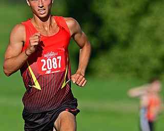 CANFIELD, OHIO - SEPTEMBER 19, 2018: Canfield's Giovanni Copploe runs to the finish line during the 2018 Suburban Cross Country meet, Wednesday afternoon at the Canfield Fairgrounds. DAVID DERMER | THE VINDICATOR