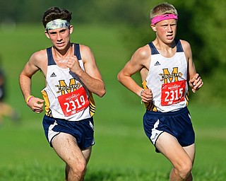 CANFIELD, OHIO - SEPTEMBER 19, 2018: McDonald's Connor Symbolik, left, and Brody Rupe, right, runs to the finish line during the 2018 Suburban Cross Country meet, Wednesday afternoon at the Canfield Fairgrounds. DAVID DERMER | THE VINDICATOR