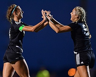 YOUNGSTOWN, OHIO - SEPTEMBER 19, 2018: Mooney's Bre Evans, left, is congratulated by Lexi Saunders, right, after scoring a goal during Wednesday nights game at the Youngstown State Soccer complex. DAVID DERMER | THE VINDICATOR
