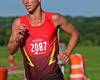 CANFIELD, OHIO - SEPTEMBER 19, 2018: Canfield's Giovanni Copploe runs to the finish line during the 2018 Suburban Cross Country meet, Wednesday afternoon at the Canfield Fairgrounds. DAVID DERMER | THE VINDICATOR