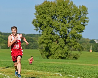 CANFIELD, OHIO - SEPTEMBER 19, 2018: Niles' Micah Curry runs to the finish line during the 2018 Suburban Cross Country meet, Wednesday afternoon at the Canfield Fairgrounds. DAVID DERMER | THE VINDICATOR