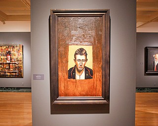 Many of John Mellencamp's most recent artworks, including his 2017 mixed media piece Thomas Hyra, center, are on exhibit in John Mellencamp: Expressionist at The Butler Institute of American Art on Thursday. EMILY MATTHEWS | THE VINDICATOR