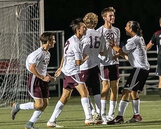 DIANNA OATRIDGE | THE VINDICATOR Boardman's Tommy Fryda receives congratulations from his teammates after scoring a goal during the Spartan's 4-1 victory over Canfield at Bob Dove Field on Thursday.