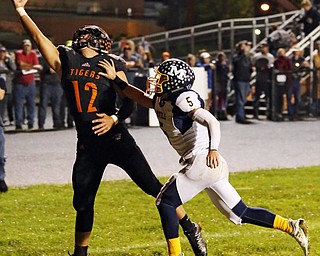 NEW MIDDLETOWN SPRINGFIELD, OHIO - September 21, 2018: MCDONALD BLUE DEILS vs SPRINGFIIELD TIGERS at Tigers Stadium-  New Middletown Springfield Tigers' Shane Eynon (12) makes a one handed catch for the TD as McDonald Blue Devils' Dominic Schadi (5) defends during the 1st qtr.  MICHAEL G. TAYLOR | THE VINDICATOR