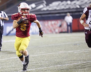 Cardinal Mooney's Nico Marchionda runs the ball down the field during Mooney's game against Boardman at Stambaugh Stadium on Friday. EMILY MATTHEWS | THE VINDICATOR