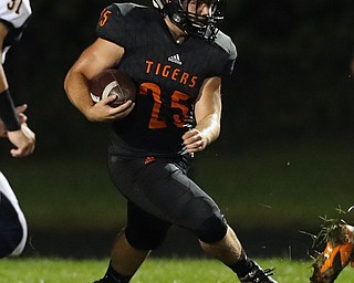 NEW MIDDLETOWN SPRINGFIELD, OHIO - September 21, 2018: MCDONALD BLUE DEILS vs SPRINGFIIELD TIGERS at Tigers Stadium-  New Middletown Springfield Tigers' Luke Snyder (25) runs for1st down during the 1st qtr.  MICHAEL G. TAYLOR | THE VINDICATOR