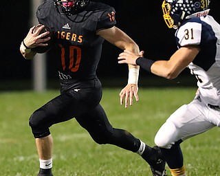 NEW MIDDLETOWN SPRINGFIELD, OHIO - September 21, 2018: MCDONALD BLUE DEILS vs SPRINGFIIELD TIGERS at Tigers Stadium-  New Middletown Springfield Tigers' Garrett Walker (10) runs for 1st down during the 1st qtr.  MICHAEL G. TAYLOR | THE VINDICATOR