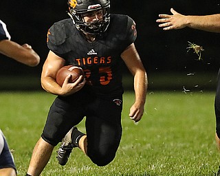 NEW MIDDLETOWN SPRINGFIELD, OHIO - September 21, 2018: MCDONALD BLUE DEILS vs SPRINGFIIELD TIGERS at Tigers Stadium-  New Middletown Springfield Tigers' Luke Snyder (25) runs for1st down during the 1st qtr.  MICHAEL G. TAYLOR | THE VINDICATOR