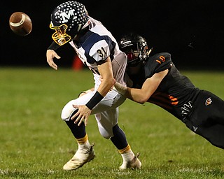 NEW MIDDLETOWN SPRINGFIELD, OHIO - September 21, 2018: MCDONALD BLUE DEILS vs SPRINGFIIELD TIGERS at Tigers Stadium-  New Middletown Springfield Tigers' Garrett Walker (10) causes McDonald Blue Devils' Alex Cintron (31) to fumble during the 2nd qtr.  MICHAEL G. TAYLOR | THE VINDICATOR