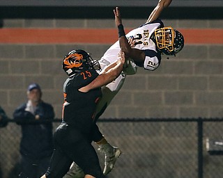 NEW MIDDLETOWN SPRINGFIELD, OHIO - September 21, 2018: MCDONALD BLUE DEILS vs SPRINGFIIELD TIGERS at Tigers Stadium-  McDonald Blue Devils' Cameron Tucker (21) as New Middletown Springfield Tigers' Luke Snyder (25) defends during the 2nd qtr.  MICHAEL G. TAYLOR | THE VINDICATOR