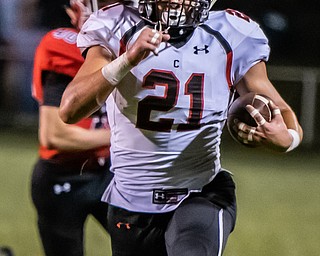 DIANNA OATRIDGE | THE VINDICATOR Canfield's Nick Crawford breaks away downfield  during their game versus Struthers at Laddie J. Fedor Field on Friday night.