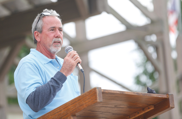 Gino Zimmer, the father of Nicholaus E. Zimmer, of the U.S. Army who lost his life in Kufa, Iraq in 2004, speaks about how his son changed his life at the closing ceremonies for the traveling memorial Sunday. EMILY MATTHEWS | THE VINDICATOR