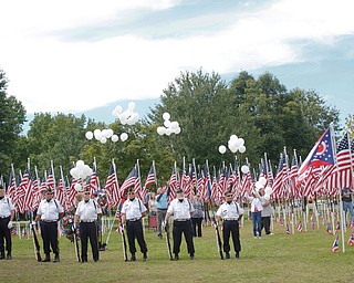 Balloons are released as part of the closing ceremonies for the traveling flag memorial on Sunday. EMILY MATTHEWS | THE VINDICATOR