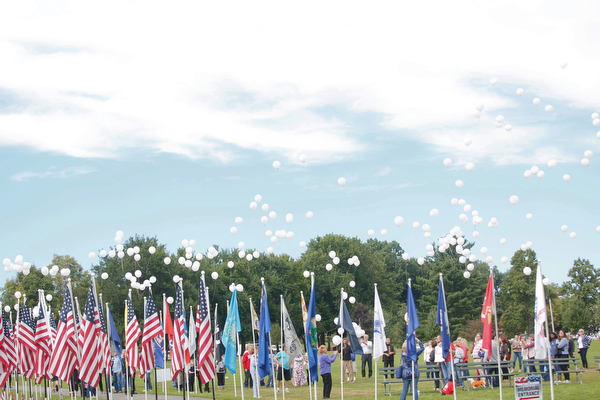 Balloons are released as part of the closing ceremonies for the traveling flag memorial on Sunday. EMILY MATTHEWS | THE VINDICATOR
