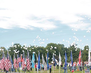 Balloons are released as part of the closing ceremonies for the traveling flag memorial on Sunday. EMILY MATTHEWS | THE VINDICATOR