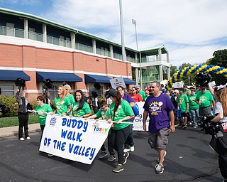 DIANNA OATRIDGE | THE VINDICATOR Participants in the Down Syndrome Association Buddy Walk of the Valley begin their trek around Eastwood Field in Niles on Sunday.