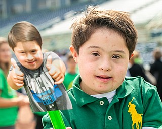 DiANNA OATRIDGE | THE VINDICATOR Quintino DeSantis, age 9, from Poland, waves a picture of himself as he participates in the Down Syndrome Association's Buddy Walk of the Valley at Eastwood Field in Niles on Sunday.