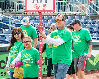 DiANNA OATRIDGE | THE VINDICATOR Samantha Nemcik (center), age 12, from Liberty, takes part in the Down Syndrome Association's Buddy Walk of the Valley with her dad, Robert Nemcik (right) and Maria Tennant (left), at Eastwood Field in Niles on Sunday.