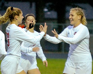 William D. Lewis The Vindicator   Canfield's Camryn Kohut(20), left, gets congrats from Marisa Scheetz(5) and Chole Kalina(22) after scoring during 9-24-18 action at Howland.