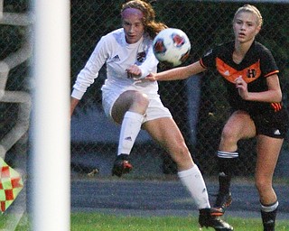 William D. Lewis The Vindicator   Canfield'sEllie Accordino(16) and Howland's Malina Andamasaris(6) during 9-24-18 action at Howland.