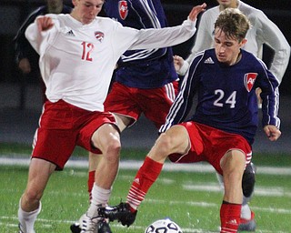 William D. Lewis The vindicator  Canfield's Alex Sorrells(12) and Fitch's Alec Herman(24) during 9-25-18 action at Fitch.