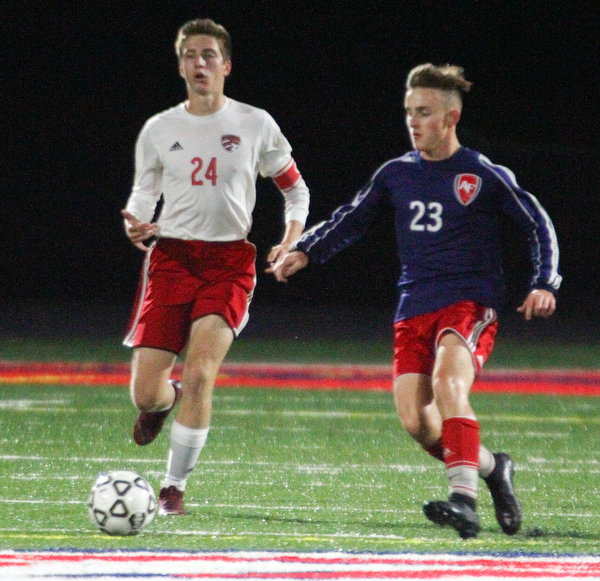 William D. Lewis The vindicator  Canfield's Mitch Mangie(24) and Fitch's Zack Glavic(23) during 9-25-18 action at Fitch.