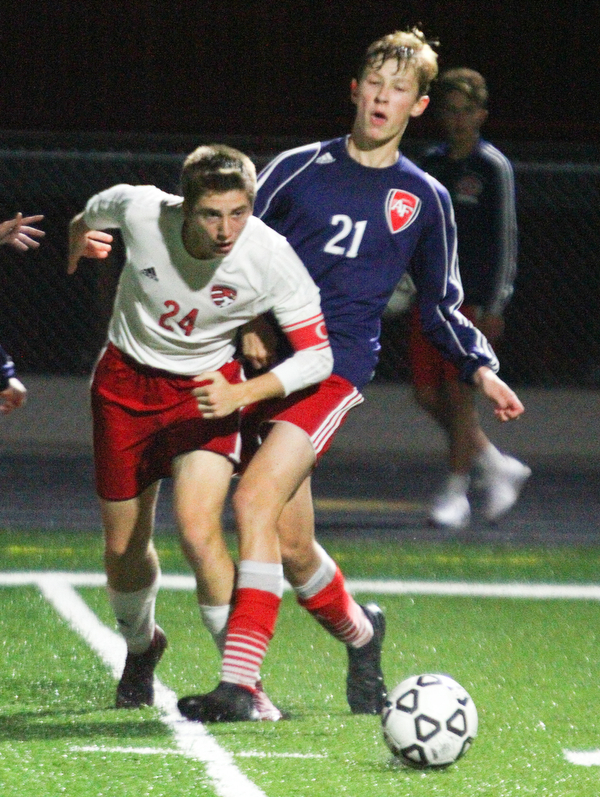 William D. Lewis The vindicator  Canfield's Mitch Mangie(24) an Fitch's Marcus Debaldo(21) during 9-25 action at Fitch.