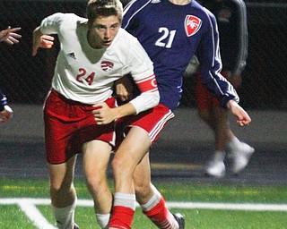 William D. Lewis The vindicator  Canfield's Mitch Mangie(24) an Fitch's Marcus Debaldo(21) during 9-25 action at Fitch.