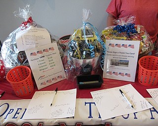 Neighbors | Jessica Harker .A raffle was offered during the first opening day of Sports Clips in Austintown, the proceeds of which were donated to Operation Troop Appreciation on Sept. 11.