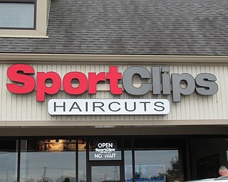 Neighbors | Jessica Harker .Pictured is the sign welcoming new customers to the Sports Clips which opened in Austintown on Sept. 11.