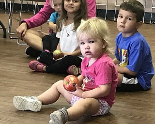 Neighbors | Jessica Harker.Camryn Porter, age 2, examined her apple on Sept. 13 at the MetroParks Farms where she attended the An Apple a Day event.