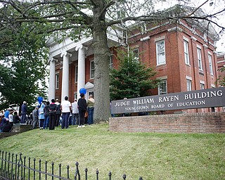 People surround the new Youngstown Rayen Early College High School during the ribbon cutting ceremony on Thursday.