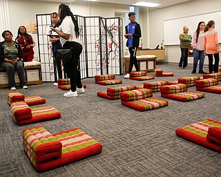 Groups visit the mindfulness room during a tour of the new Youngstown Rayen Early College High School on Thursday. The mindfulness room gives students a space to meditate and practice yoga.