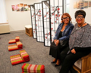 Rev. Jeannette Hubbard, the pastor of St. Andrews A.M.E. Church in Youngstown, left, and Nancy Murray, the mother of Monica Jones, the principal of the Youngstown Rayen Early College High School, pose for a photo in the mindfulness room inside the new Youngstown Rayen Early College High School on Thursday. The mindfulness room gives students a space to meditate and practice yoga.