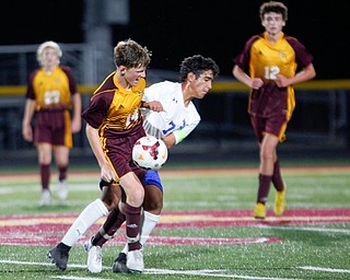 Hubbard's Nader Kassem and South Range's Camden Thomas go after the ball during the second half of their game at South Range on Thursday. EMILY MATTHEWS | THE VINDICATOR