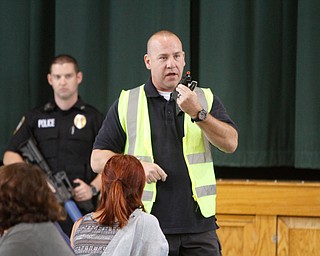  ROBERT K.YOSAY  | THE VINDICATOR..Sgt Chris Moffitt -  shows the weaponry that will be used in the training session.. The Eagle Joint Fire District in conjunction with the Hubbard City Police, Hubbard TWP Police, other area safety forces  including Mercy Health Hospitals and Trumbull Memorial Hospital, St. PatrickÕs Parish Center in Hubbard, Ohio...