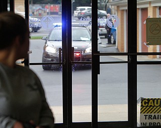  ROBERT K.YOSAY  | THE VINDICATOR.. Police arrive as the shooter - Officer Taylor Beshara looks over her shoulder...The Eagle Joint Fire District in conjunction with the Hubbard City Police, Hubbard TWP Police, other area safety forces  including Mercy Health Hospitals and Trumbull Memorial Hospital, St. PatrickÕs Parish Center in Hubbard, Ohio...