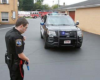  ROBERT K.YOSAY  | THE VINDICATOR.. helping bring in the  safety vehicles Justin Meade radios for more ambulances and help..The Eagle Joint Fire District in conjunction with the Hubbard City Police, Hubbard TWP Police, other area safety forces  including Mercy Health Hospitals and Trumbull Memorial Hospital, St. PatrickÕs Parish Center in Hubbard, Ohio...