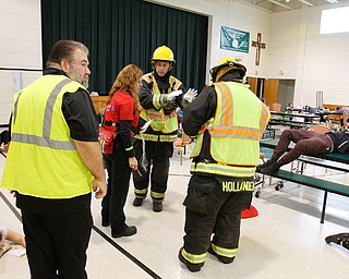  ROBERT K.YOSAY  | THE VINDICATOR.. Christina Bell works with  Hubbard Fire - coordinating  the wounded....The Eagle Joint Fire District in conjunction with the Hubbard City Police, Hubbard TWP Police, other area safety forces  including Mercy Health Hospitals and Trumbull Memorial Hospital, St. PatrickÕs Parish Center in Hubbard, Ohio...