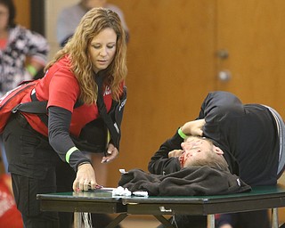  ROBERT K.YOSAY  | THE VINDICATOR.. The Eagle Joint Fire District in conjunction with the Hubbard City Police, Hubbard TWP Police, other area safety forces  including Mercy Health Hospitals and Trumbull Memorial Hospital, St. PatrickÕs Parish Center in Hubbard, Ohio...Checking a victims condition is Christina Bell