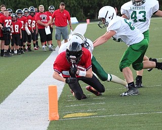 Neighbors | Submitted.Canfield's Danny Inglis is pictured reaching for the pylon in the game against Ashtabula Lakeside. Canfield was victorious over their opponent 20-0.