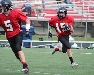 Neighbors | Submitted.Canfield seventh-grade football player Scottie Eaton dashed around the left end against Lakeside at the recent game. Canfield was victorious at the game and continued its undefeated streak for the season.
